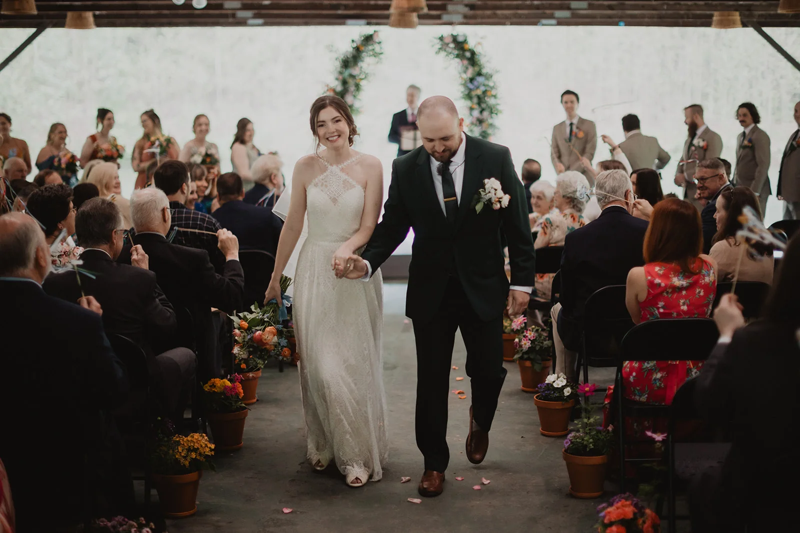Bride walking down the aisle during an intimate ceremony at Coolfont Resort